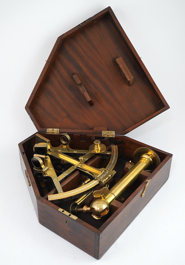 A 19th century Troughton & Simms, London, cased brass sextant, stamped number 2207, engraved for Lieut. Clark R.A., cased with stand and other accessories, case 36.5cm x 34.5cm. Condition - good